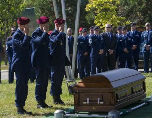 Three U.S. Air Force Special Operations Airmen, salute the casket of Tech. Sgt. Timothy Officer during his funeral at Arlington National Cemetery, Va, Oct. 5, 2015.